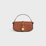 CLUTCH ON STRAP TABOU IN SMOOTH CALFSKIN TAN
